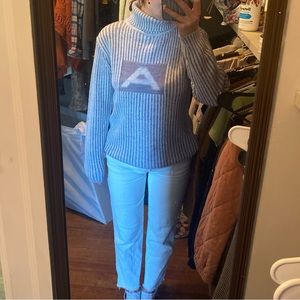 Cozy, corded turtleneck sweater.